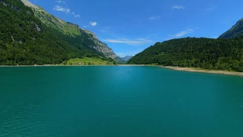 FPV Flight Across a Turquoise Alpine Lake in Switzerland 스톡 동영상 340424246