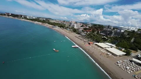 FPV Flight Along Coastal Resort with Hotels and Beach Stock Footage 309038079