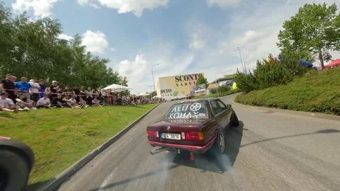 FPV  Flight Behind Red Classic BMW in Qualifying Drift Stock Footage 322973392