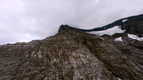 FPV Flight diving down west flank of the EIGER Switzerland Grindelwald Stock Footage 293741942