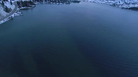 FPV flight with an eagle over a Canadian lake in winter 動画素材 224732771