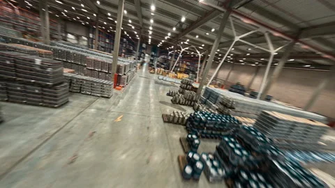 FPV flight inside warehouse. Huge industrial modern logistics park station Stock Footage 165420056