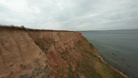 FPV flight over a coastal cliff at cloudy day Stock-Footage 168883630