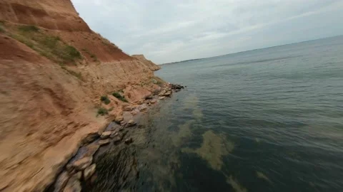FPV flight over a coastal cliff at cloudy day Stock-Footage 168885308