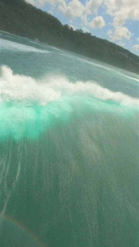 FPV flight over crystal clear turquoise water and splashing ocean waves in Bali Stock Footage 288192974