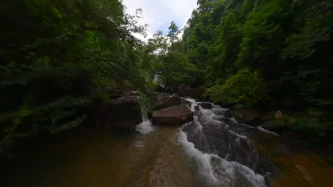 FPV flight over river and waterfall in the lush jungle in Thailand Stock Footage 278315688