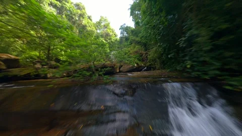 FPV flight over river and waterfall in the lush jungle in Thailand Stock Footage 288095909
