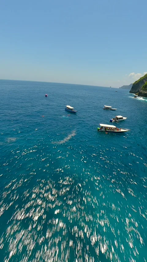 FPV flight over turquoise ocean waters at Manta Point on Nusa Penida, Bali Stock Footage 288489171