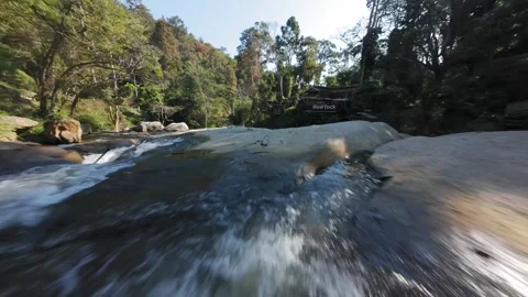 FPV Flight Over Waterfalls and River Rock Bar  Mae Cham Stock Footage 332794469