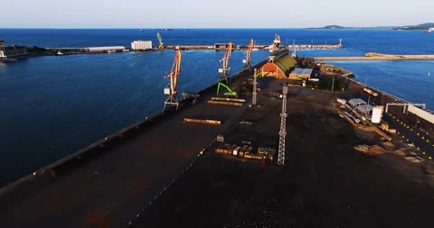 Fpv Flight Through Loading Platforms On Dock Cargo Bay Sunset Vibrant Aerial Video stock 300488889