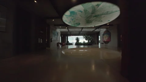 FPV flight through modern concrete villa toward infinity pool over jungle. Stock Footage 342573311