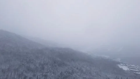 Fpv flight through narrow snowy mountain pass Stock Footage 321251414