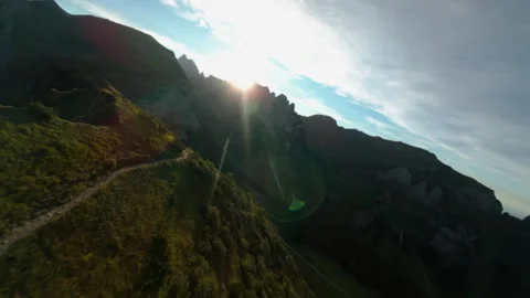 FPV flying at the top of a mountain at sunset, Saxer Lücke, Switzerland Stock Footage 317218927