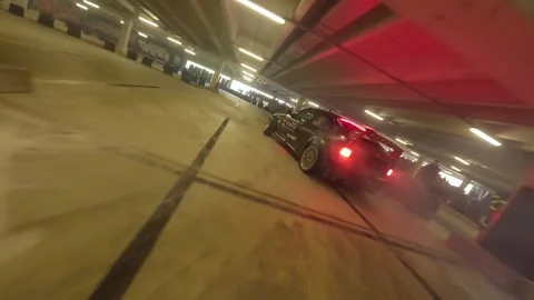 FPV Garage Drift: Ground-Level Launch Into Smooth Solo Run Stock Footage 327036448