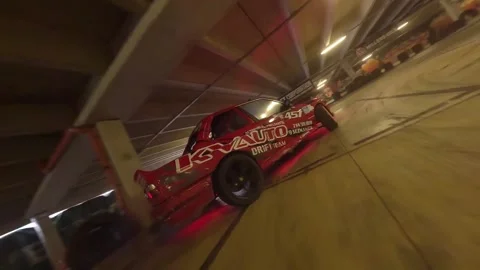 FPV Garage Drift: Low-Angle Red BMW Solo Performance Stock Footage 327036528