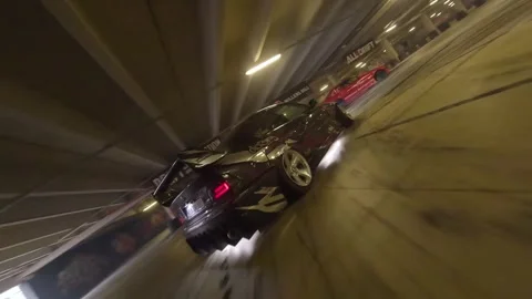 FPV Garage Drift: Stylish Chase Through Tight Corners Stock Footage 327035521