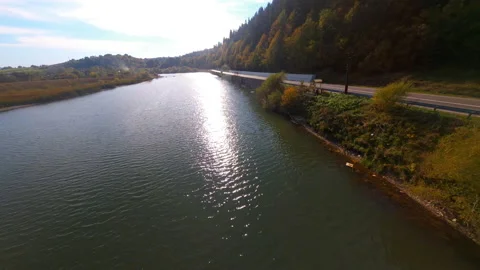 FPV inspiring drone flight views of picturesque mountains, long deep river water Stock Footage 182058379