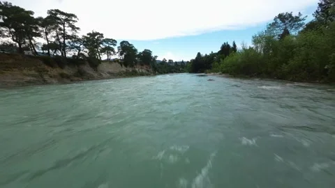 FPV Low Glide Along Scenic River in Forest Landscape Stock Footage 309037939