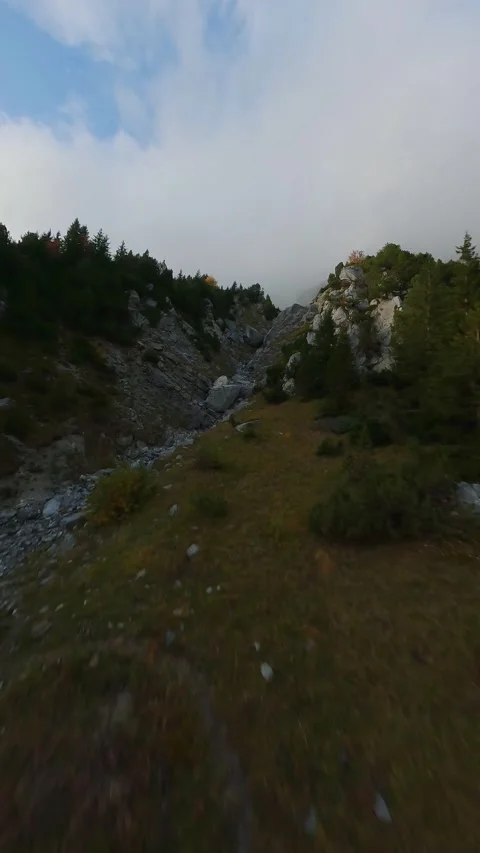 FPV maneuverable flight above the mountain range in Swiss Alps Stock Footage 223501211