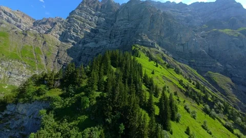 FPV Mountain Ascent and Descent Toward a Turquoise Swiss Alpine Lake 스톡 동영상 340461068