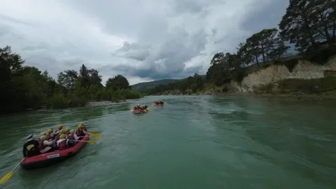 FPV Orbit Around Multiple Rafting Boats on Scenic River Stock Footage 309037533