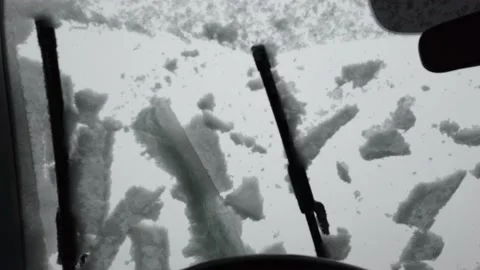 FPV point of view, driving with heavy snowing on the windshield Stock Footage 151288252