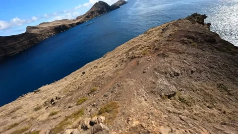 FPV racing drone Mountain surfing, and cliff diving along the rocks. Epic Stock Footage 166898567
