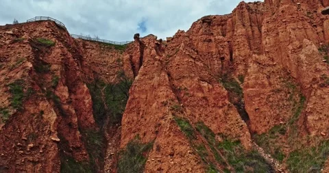 Fpv Rise Over Clay Sandy Mountain Ridge Reveal Small Village Aerial Drone Stock Footage 300475604