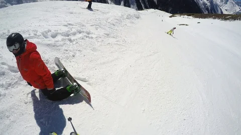 FPV Skier slopes down hill following shadow. Good weather for skiing. Action Stock Footage 109180584