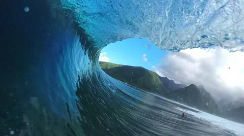 FPV SLOW MOTION: Pro surfer surfing big tube barrel wave Stock Footage 61220531