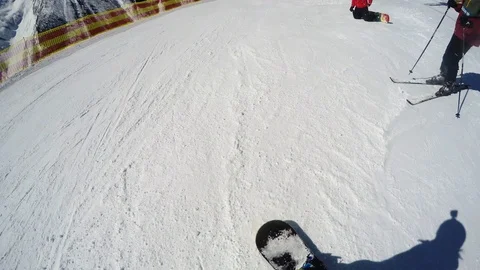FPV snowboarder slopes down hill. Shadow of snowboarder. Beginner level. Action Stock Footage 109131423
