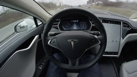 FPV Tesla Model S automated electric car autosteering with no driver on highway Stock Footage 72835454