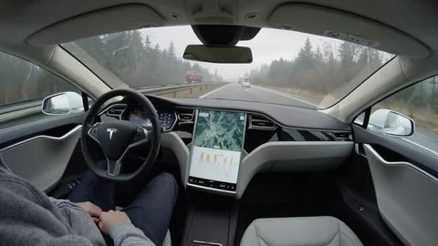 FPV Tesla Model S autopilot self-steering no-hands driving experience on highway Stock Footage 72835423