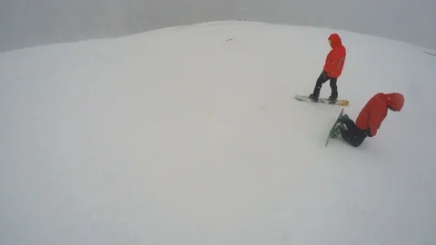 FPV Unrecognizable skier skiing down slope. View of snowboarders sloping down Stock-Footage 108533760