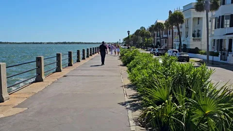 FPV-Walking along raised sidewalk at Battery Point, Charleston Stock Footage 332961336