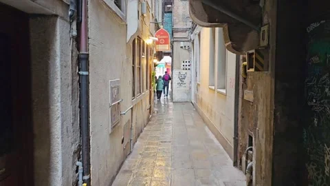 FPV-Walking down narrow wet Venice Alley Stock Footage 281697880