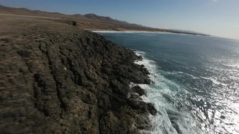Fpv waves coast run El Cotillo Fuerteventura drone aerial Canary Island Spain Stock Footage 223581788