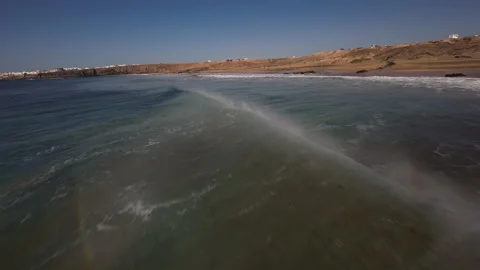 Fpv waves rainbow El Cotillo Fuerteventura drone flying beach Canary Island Stock Footage 223581799
