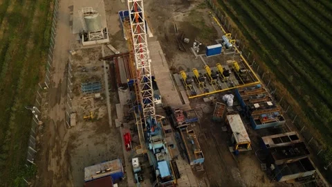 Fracking drilling for shale gas in a field Stock Footage 281239831