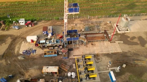 Fracking drilling for shale gas in a field Stock Footage 281240058