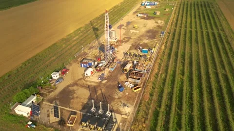 Fracking drilling for shale gas in a field Stock Footage 281240134