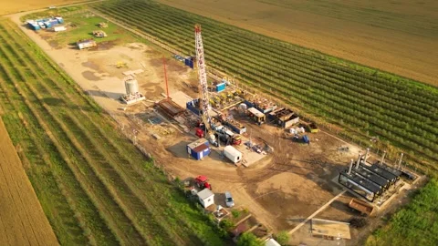 Fracking drilling for shale gas in a field Stock Footage 281240135