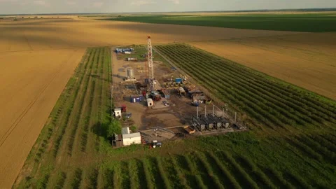 Fracking drilling for shale gas in a field Stock Footage 281240148