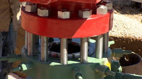 Fracking equipment being assembled and getting fitted onsite Stock Footage 125685058