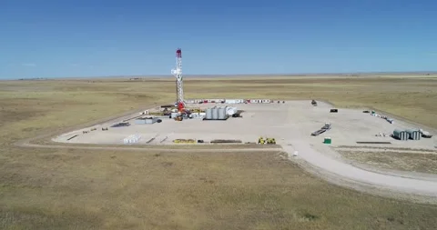 Fracking pad large rig drop and pan from a drone. 4K drone 60fps Stock Footage 167931337