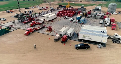 Fracking site revealed by a rising drone.  This gives a view of the Stock Footage 114151426