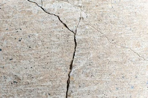 Fractured concrete surface closeup background or texture. Natural destruction Stock Photos