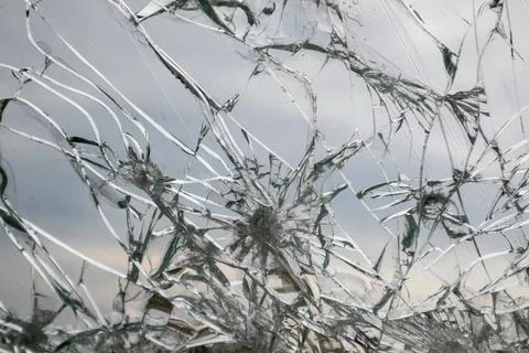 Fractured Glass Window with Cracked Web Pattern Stock Photos