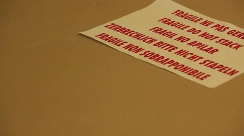Fragile sticker on a shipping box Stock Footage 24521619