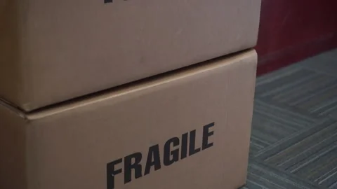 Fragile text warning on paper boxes package video Stock Footage 139101314